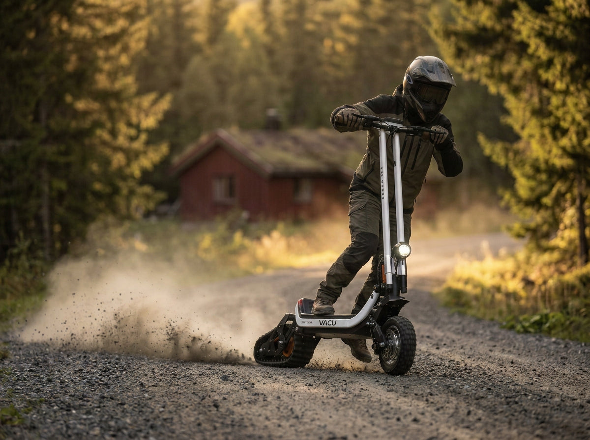 VACU med hjul og belte på grusvei